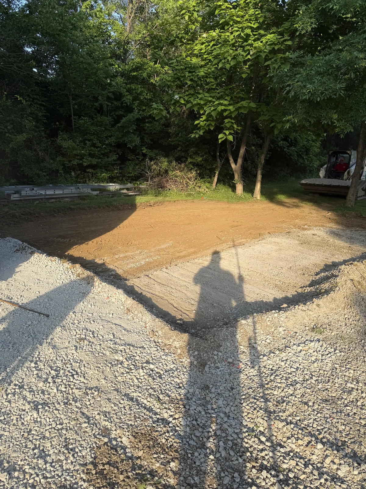 Concrete project by E & J General Contracting — Poured Concrete Slab in Louisville, KY (June 2026). Full poured concrete slab for an RV/camper pad — site prep, gravel base, wire mesh reinforcement, forms, and pour. Finished flat and jointed so the slab performs for the long haul.